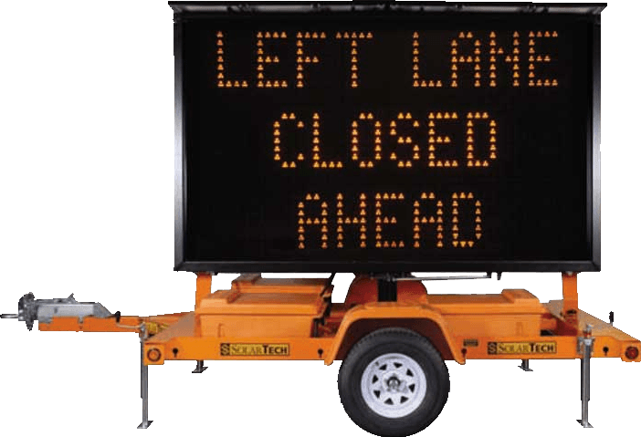 Trailer-mounted programmable message board displaying LEFT LANE CLOSED AHEAD