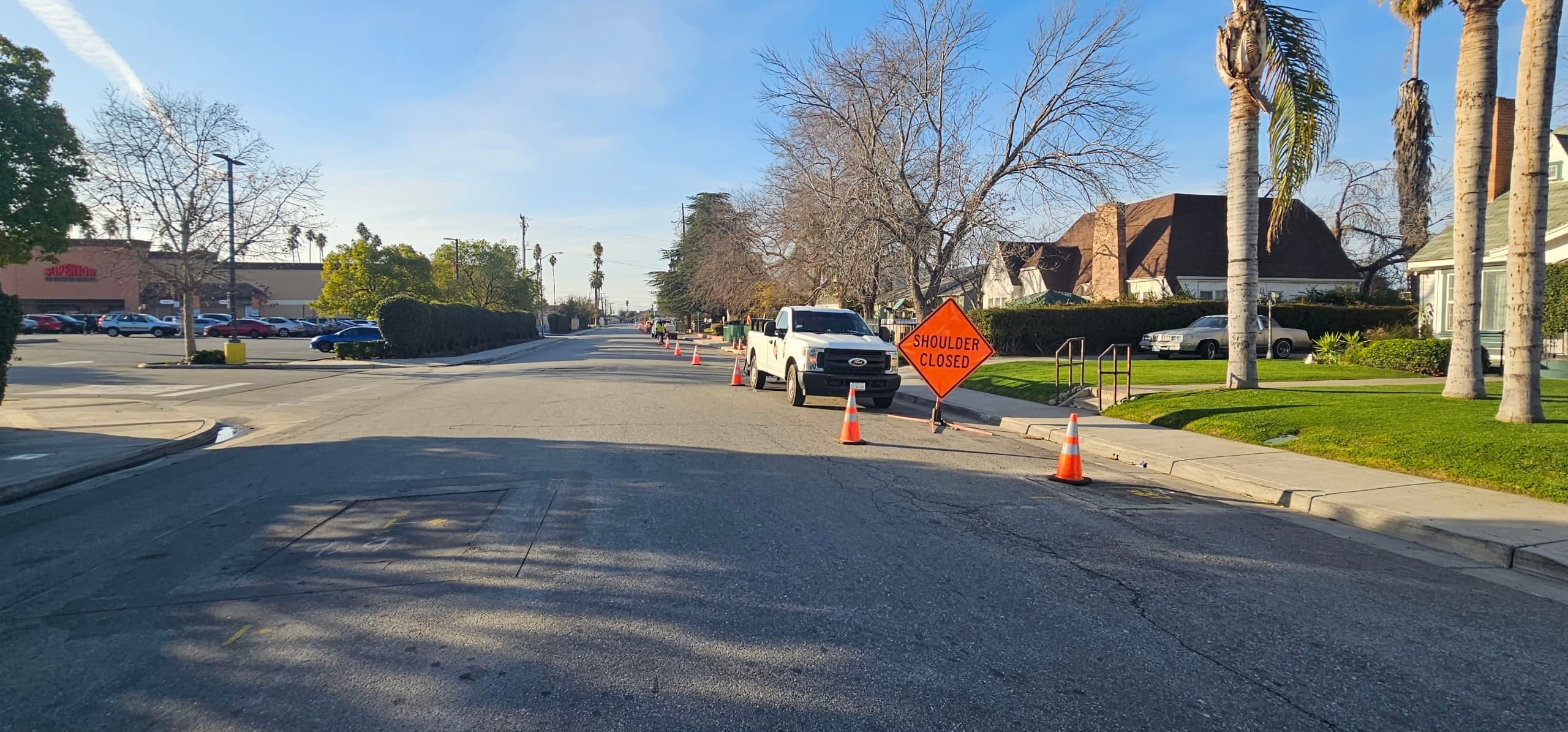 Cones and B&F Traffic Control trucks lining a street work zone