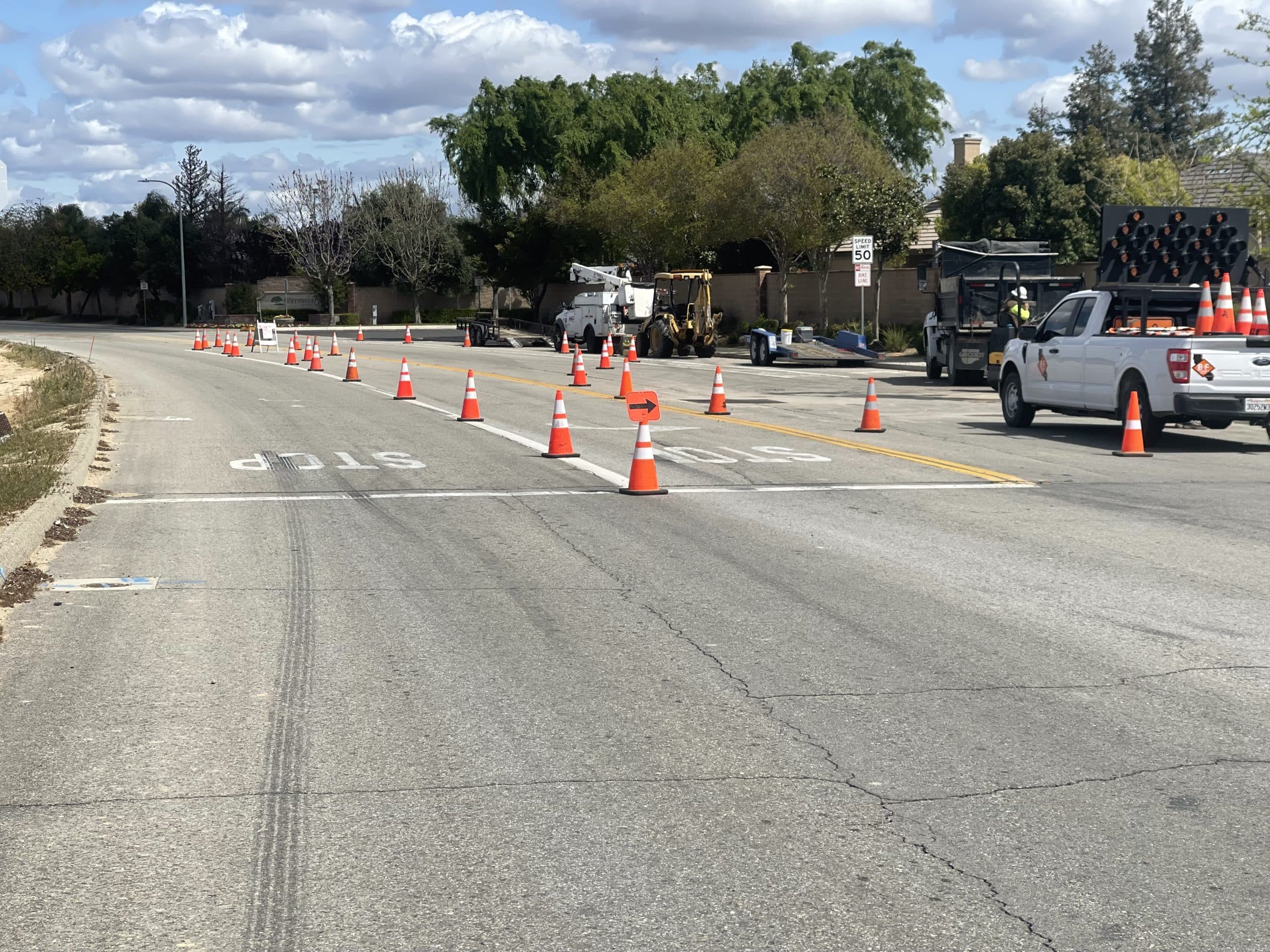 Cone taper closing a lane with an arrow board truck at the work area