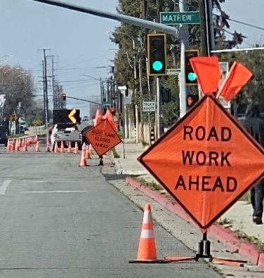 a road work ahead sign on a street